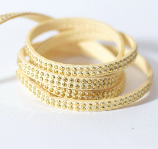 Buy suede studded 5x2mm beige with golden rhinestones - Swedish cord sold by meter