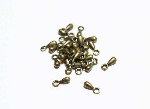 Achat au détail 20 perles gouttes larmes bronze 3x7mm apprèts bijoux